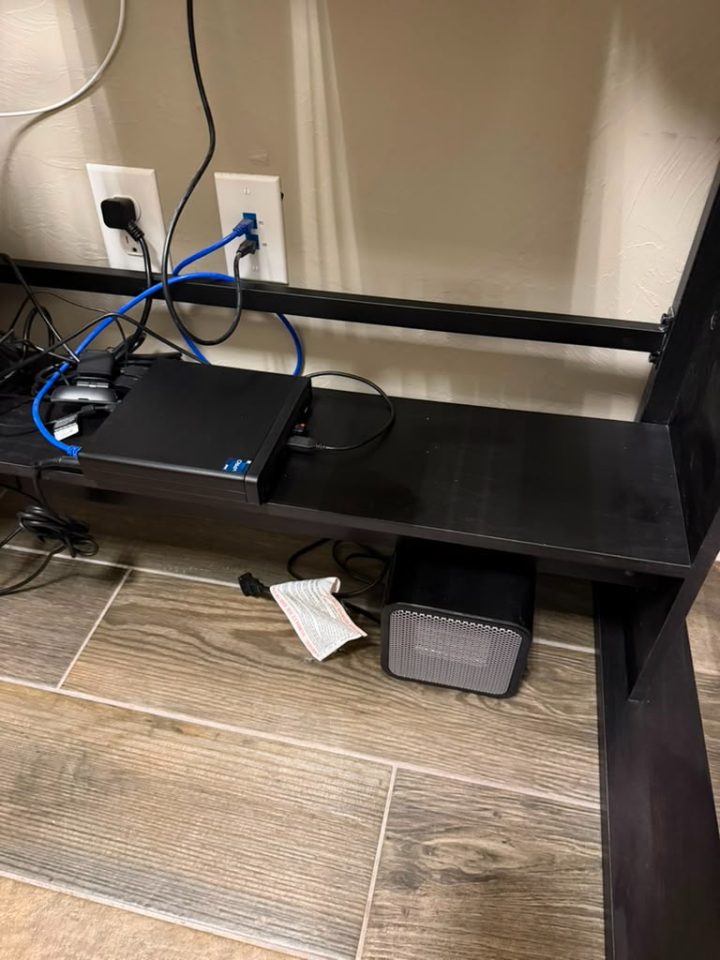 After — equipment shelf dusted and cables tidied