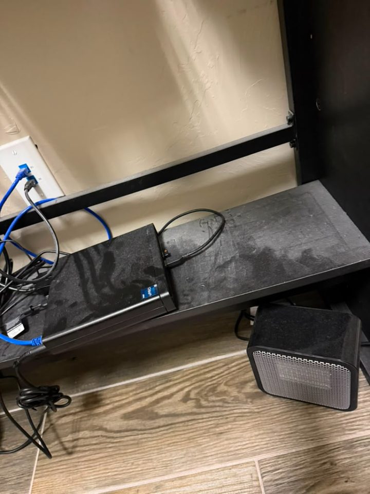 Before cleaning — dusty equipment shelf with tangled cables